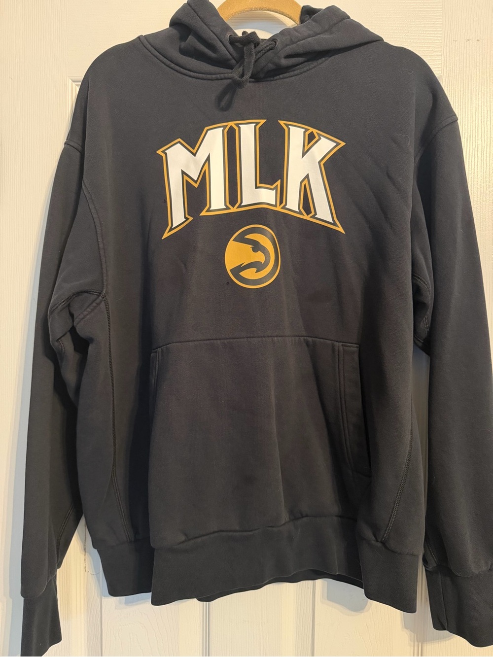 L Black ATL Hawks MLK Pullover Hoodie with Gold Graphic